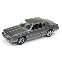 Johnny Lightning 1:64 Scale 1984 Oldsmobile Cutlass (Coffee and Cars) Medium Gray Poly
