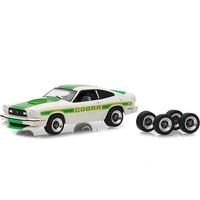 Greenlight 1:64 Scale The Hobby Shop Series 5 1978 Ford Mustang II Cobra II, white with green Billboard Stripes And Spare Tires