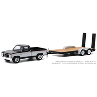 Greenlight 1:64 Scale Hitch & Tow Series 20 - 1986 GMC Sierra Classic 2500 with Flatbed Trailer (Black)