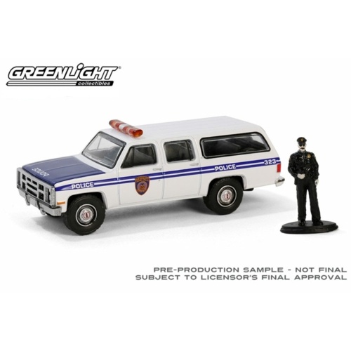 Greenlight 1:64 The Hobby Shop Series 16 - 1985 GMC Suburban 2500 with Police Officer Figure